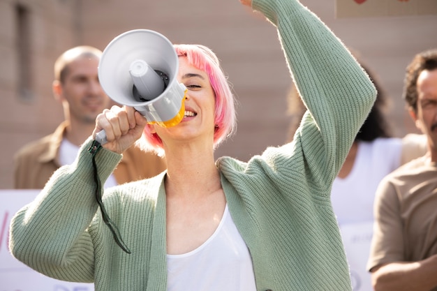 Close up woman holding megaphone