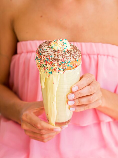 Close-up woman holding milkshake