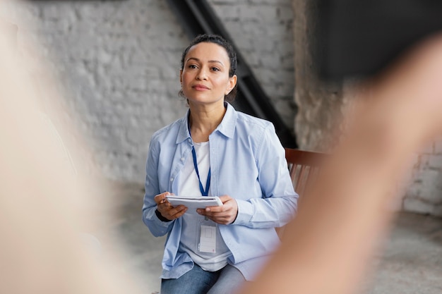 Free photo close up woman holding notebook