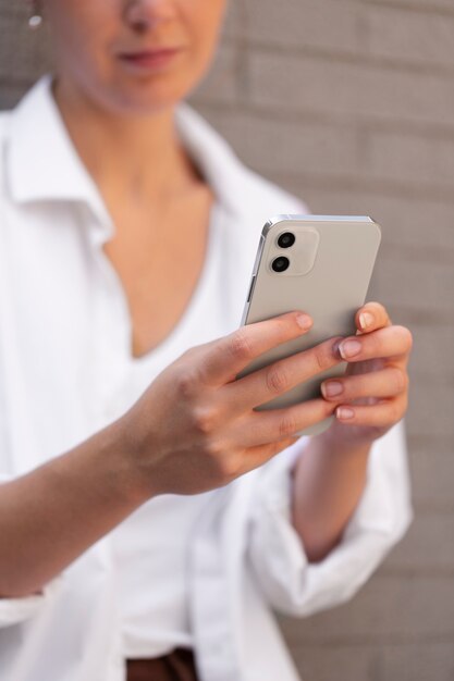 Close up woman holding phone