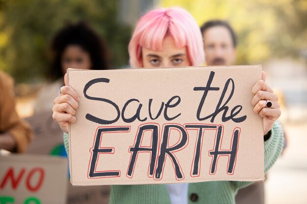 Close up woman holding placard