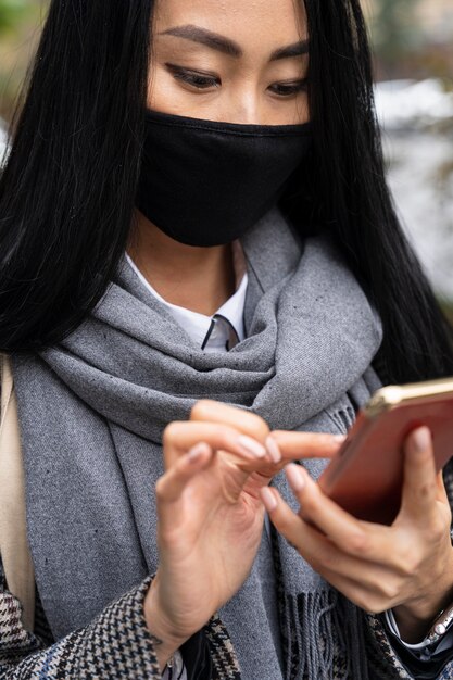close-up woman holding smartphone