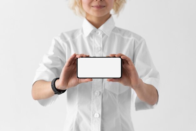 Close up woman holding smartphone