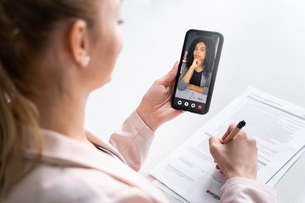 Close up woman holding smartphone