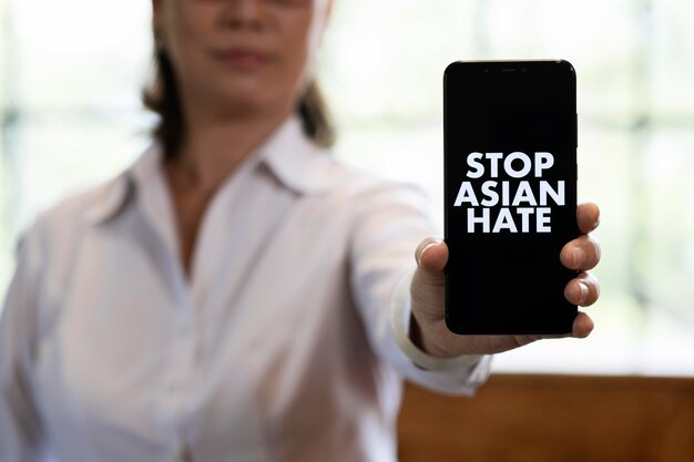 Close up woman holding smartphone