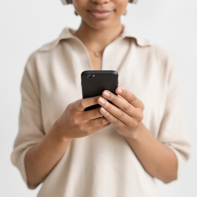 Close up woman holding smartphone