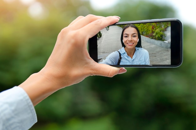 Close up woman holding smartphone