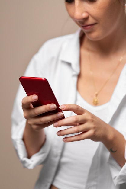 Close up woman holding smartphone