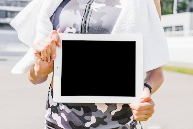 Close-up of woman holding tablet mock-up