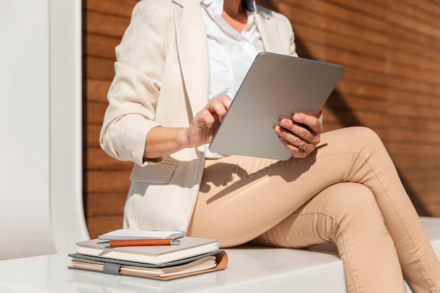 Close-up woman holding tablet