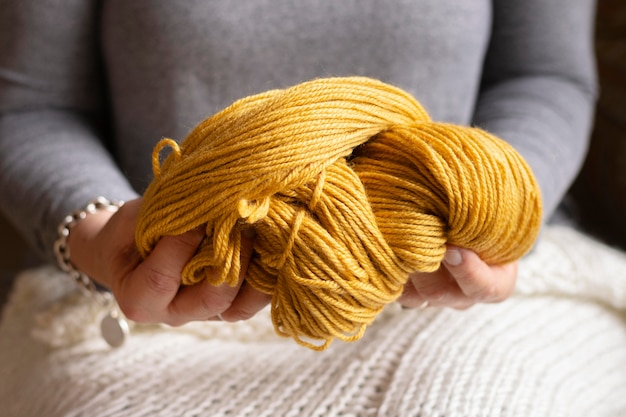 Close-up woman holding wool