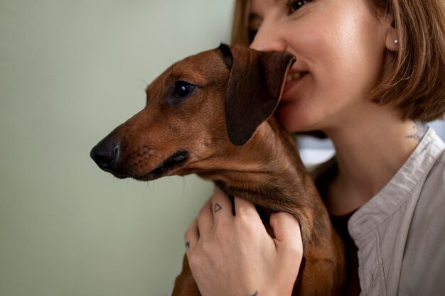 Close up on woman hugging her pet dog