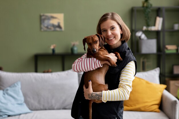 Close up on woman hugging her pet dog