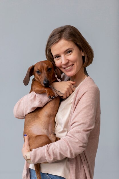 Close up on woman hugging her pet dog