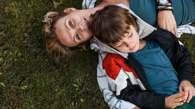 Close-up woman and kid on grass