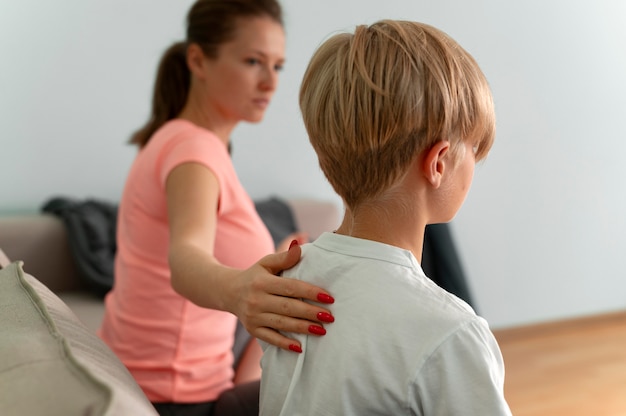 Close up woman and kid indoors