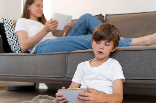 Close up woman and kid with devices