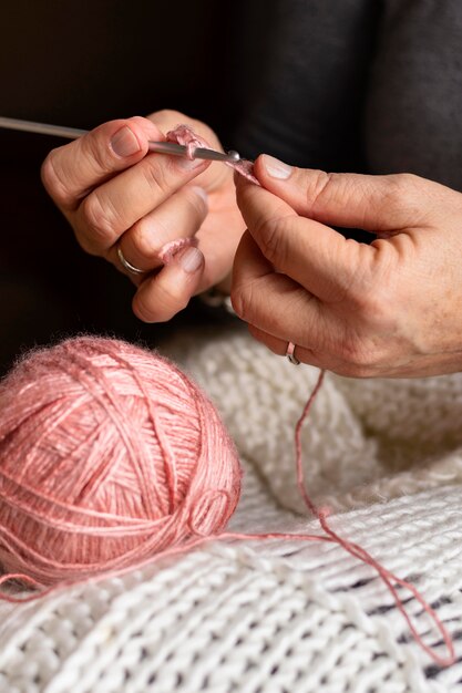 Close-up woman knitting