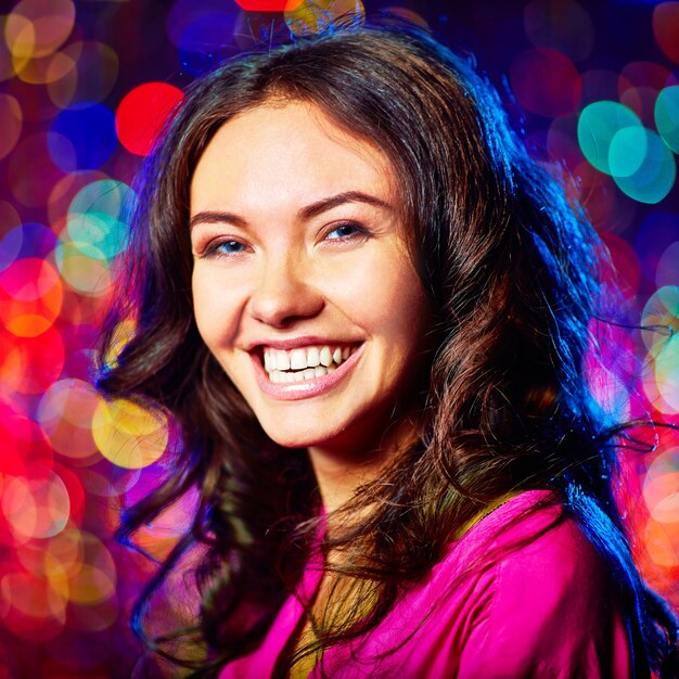 Close-up of woman laughing in the nightclub