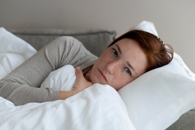 Free photo close up woman laying on couch