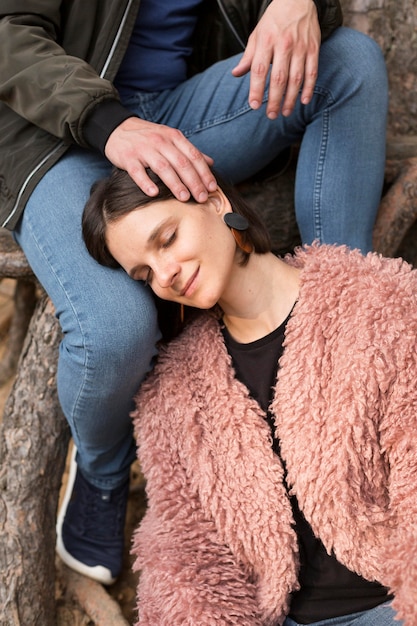 Close-up woman laying on partner leg