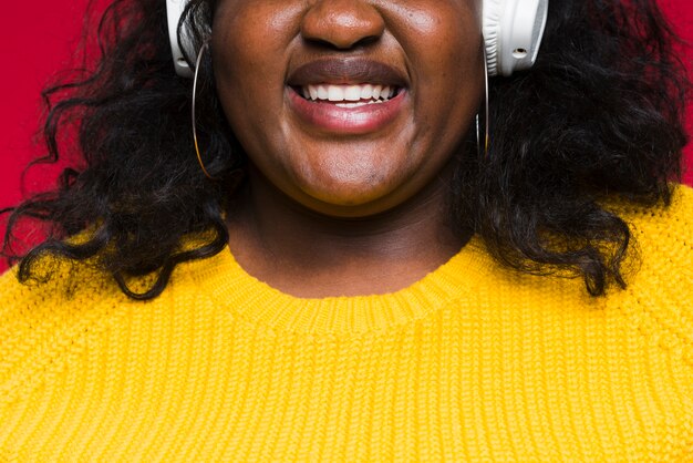 Close-up woman listening music