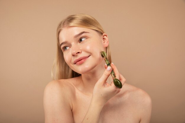 Close up woman massaging face