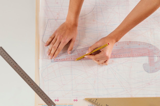 close-up woman measuring with ruler
