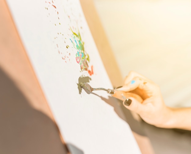 Close up of woman painting outdoors