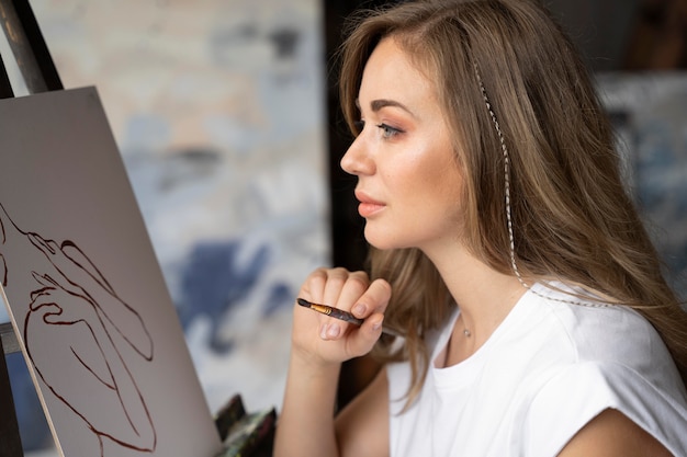 Close up woman painting