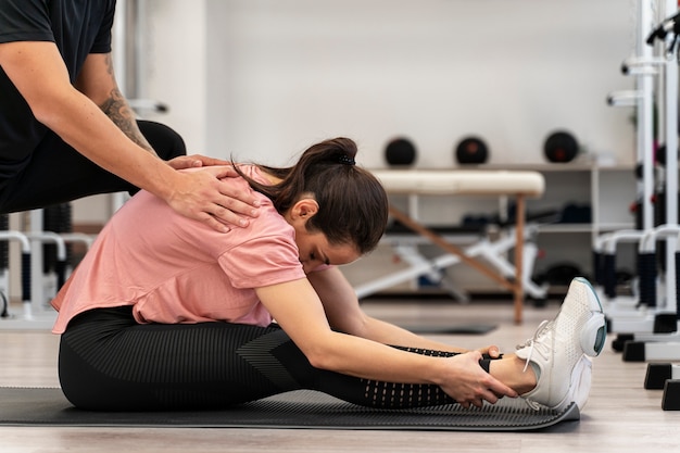 Close up woman physical rehabilitation at gym