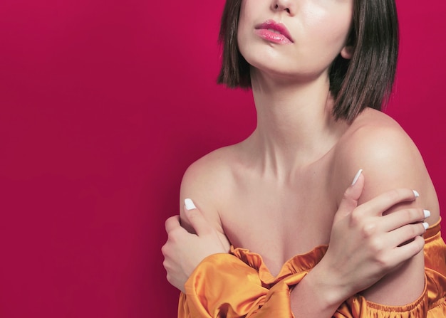 Close-up of woman posing with arms crossed