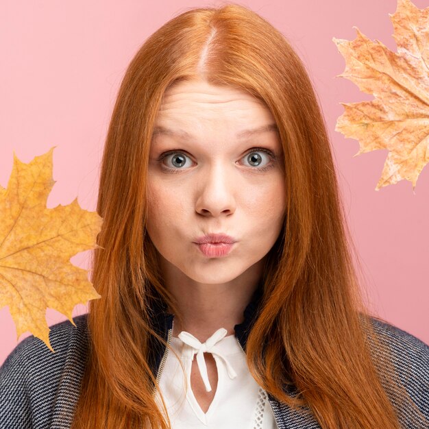 Close-up woman posing with leaves