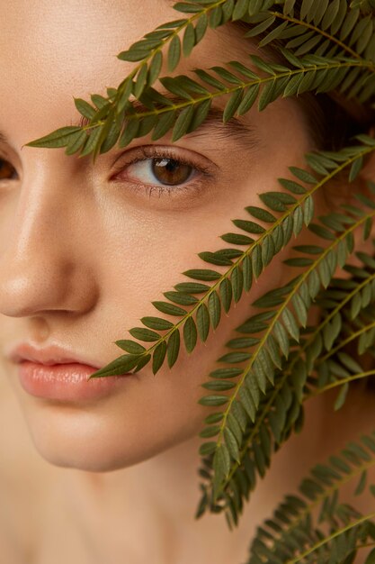 Close up woman posing with plant