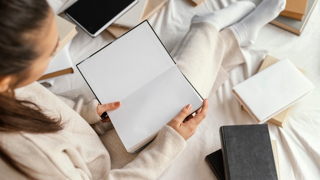 Close up woman reading in bed