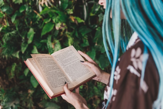 Close-up of a woman reading book