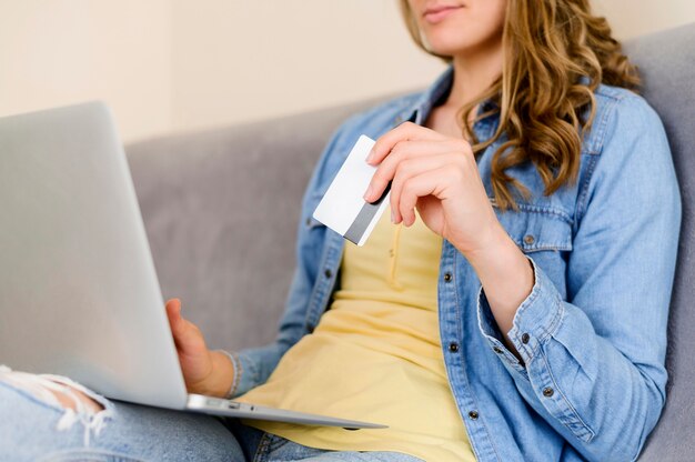 Close-up woman ready to buy online products