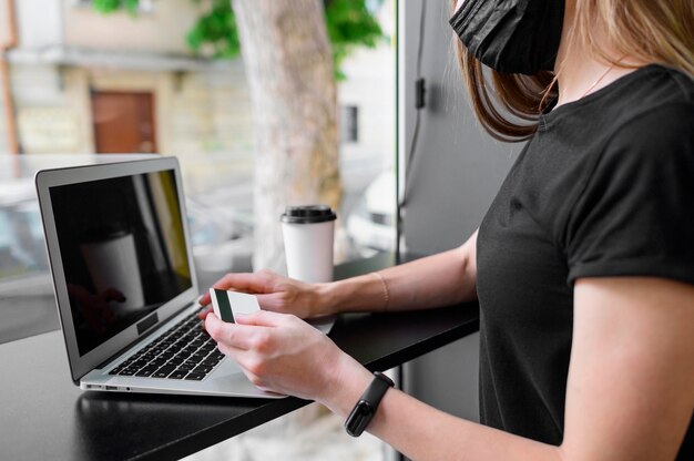 Close-up woman ready to purchase online