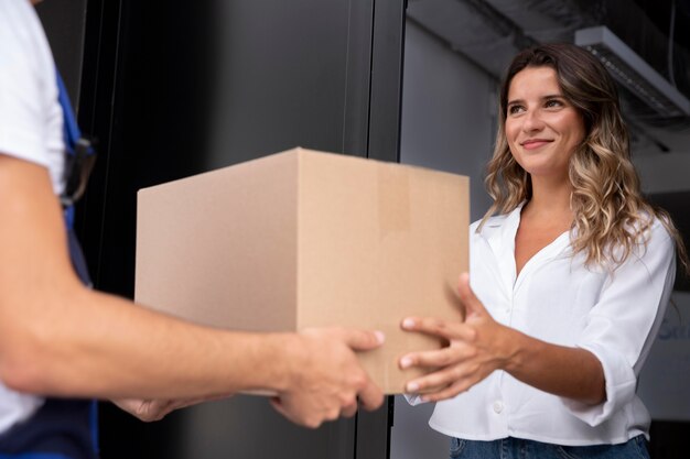 Close up woman receiving pack