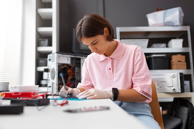 close up on woman repairing computer chips
