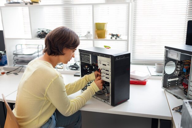 Close up on woman repairing computer chips