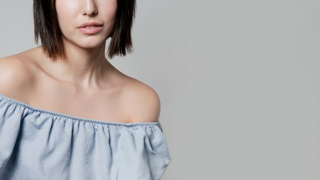 Close-up of woman in ruffle shirt