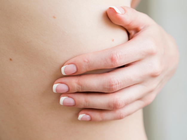 Close up woman's hand and body