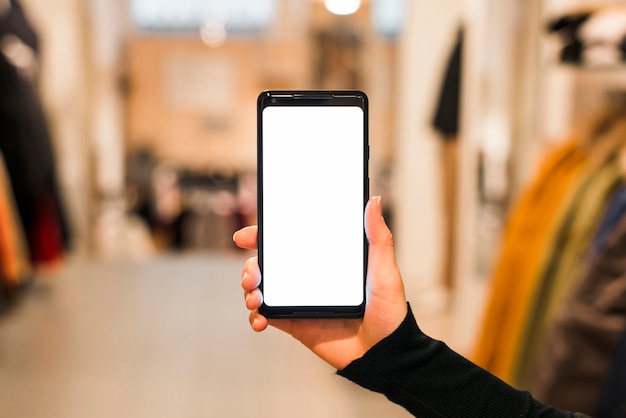 Close-up of woman's hand showing her smart phone with white screen display