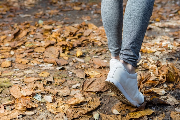 Close-up of a woman's white trainers