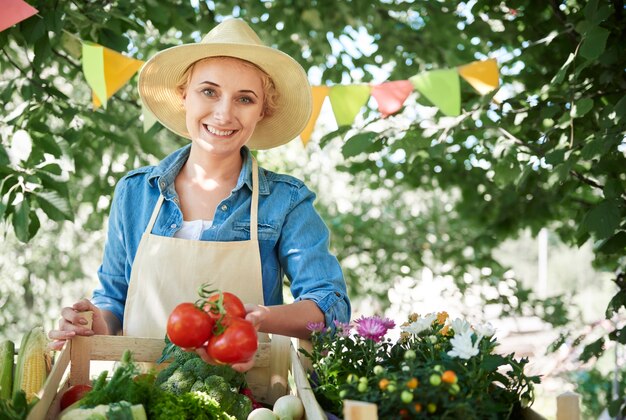 Close up on woman seeling crops from her garden