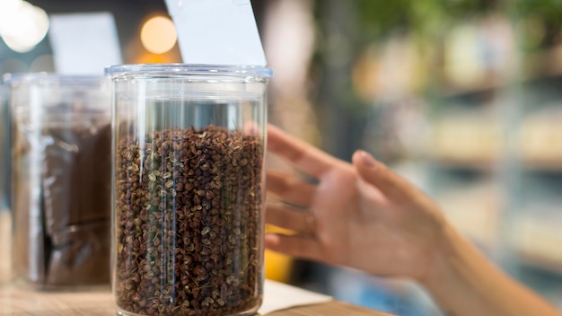 Close-up woman shopping organic spices