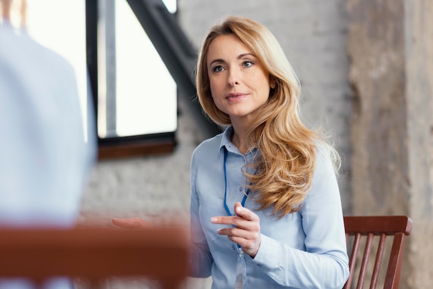 Close up woman sitting on chair