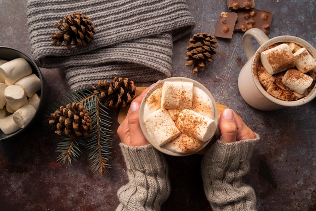 Close-up woman in sweater with delicious beverage