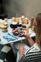 Free photo close up woman taking food bowl photos